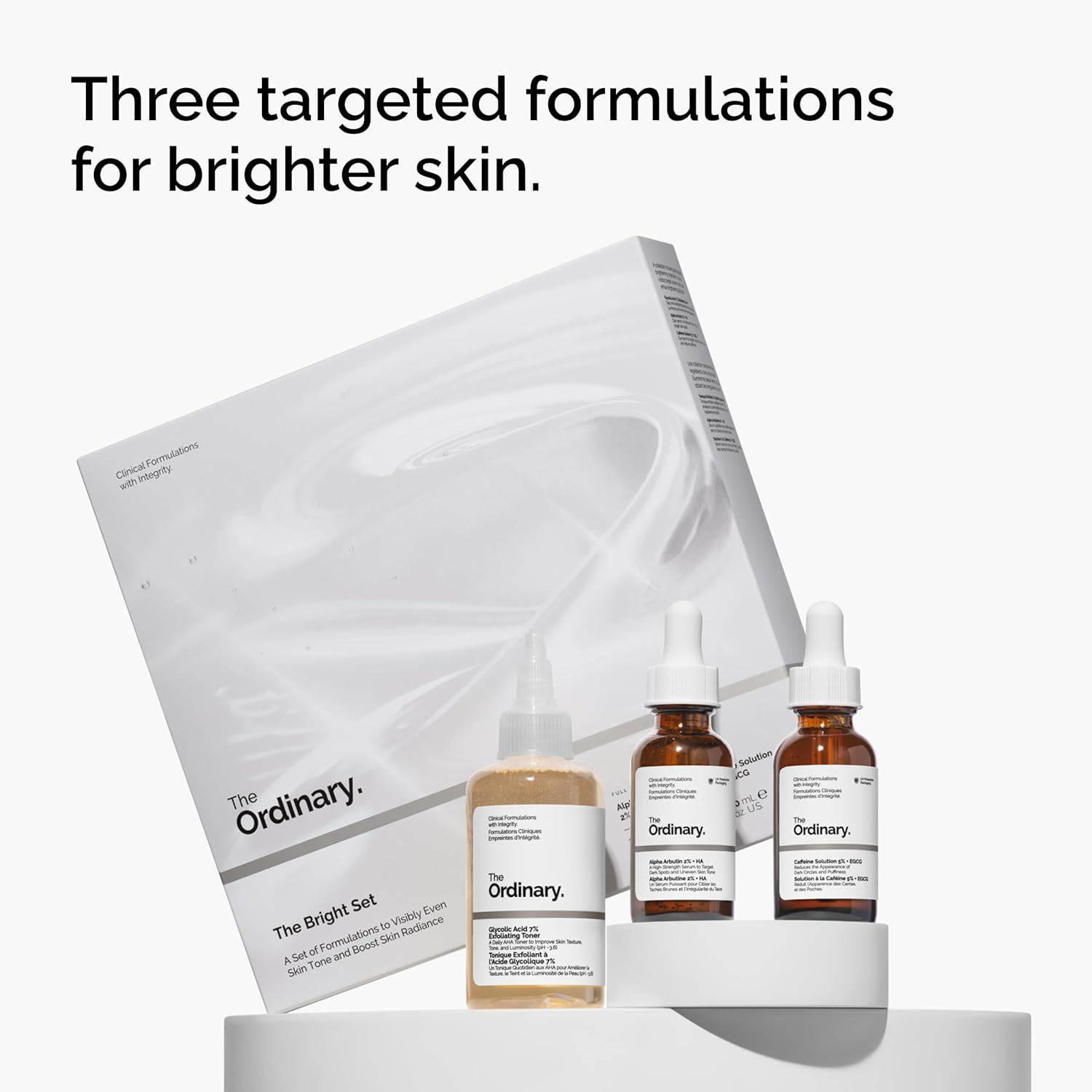 The Ordinary The Bright Set skincare regimen includes exfoliating toner, brightening serum, and eye serum for radiant, even skin tone