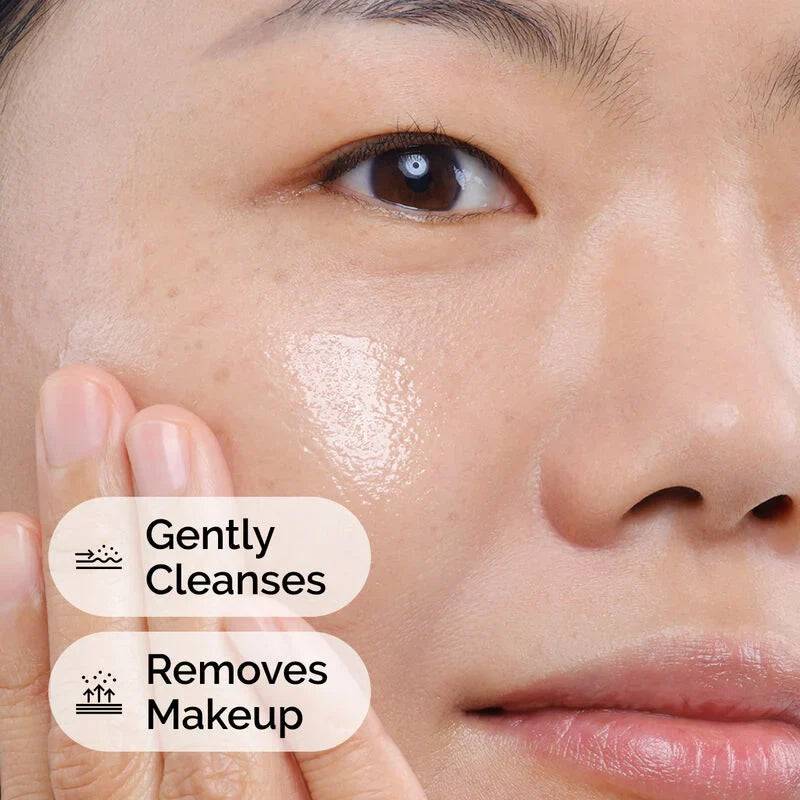 SlimBag Squalane Cleanser being applied to the face, showcasing its gentle, hydrating formula for smooth, refreshed skin.
